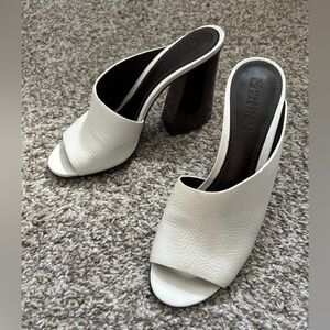 Mercedes Castillo white asymmetrical leather heels